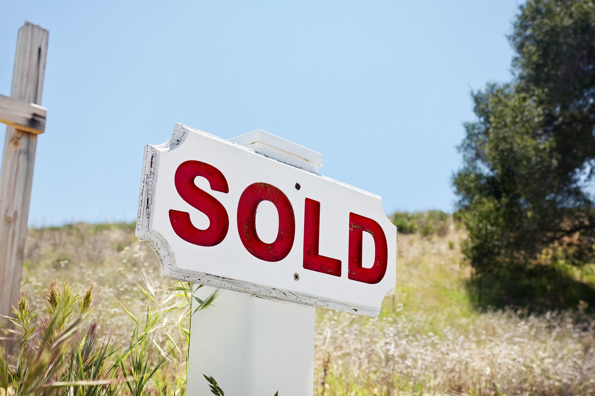 Sold sign on land