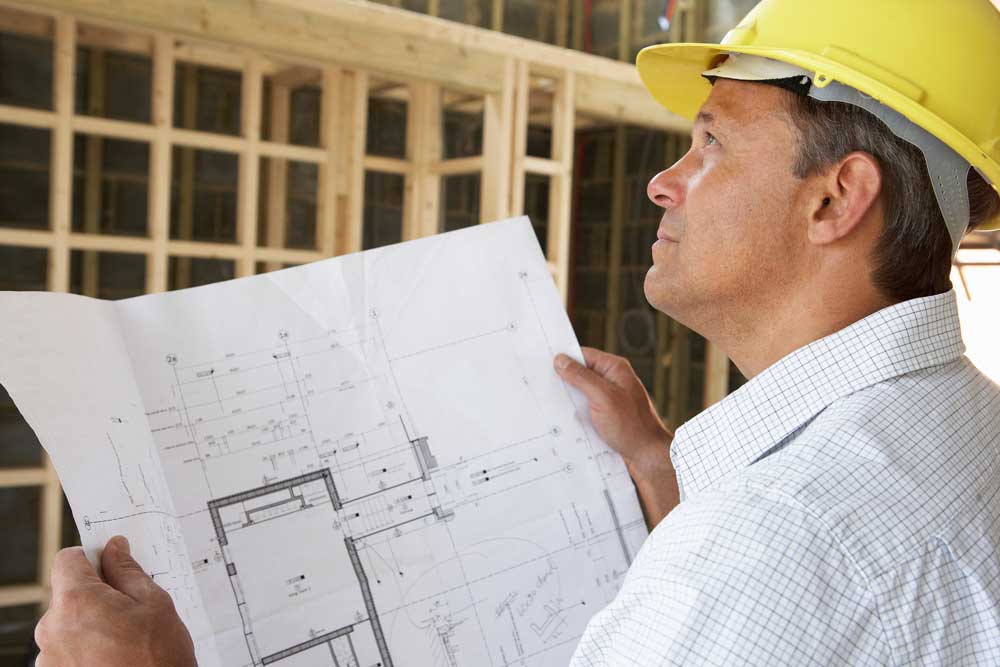 Builder with plans.jpg
